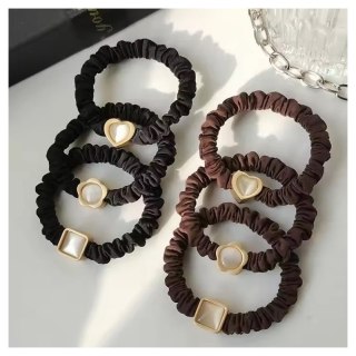 Zestaw frotek gumek 6w1 na plakietce, czarne i brązowe z masa perłową GUM187